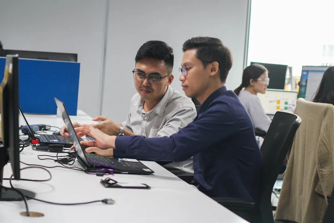 team working on laptops